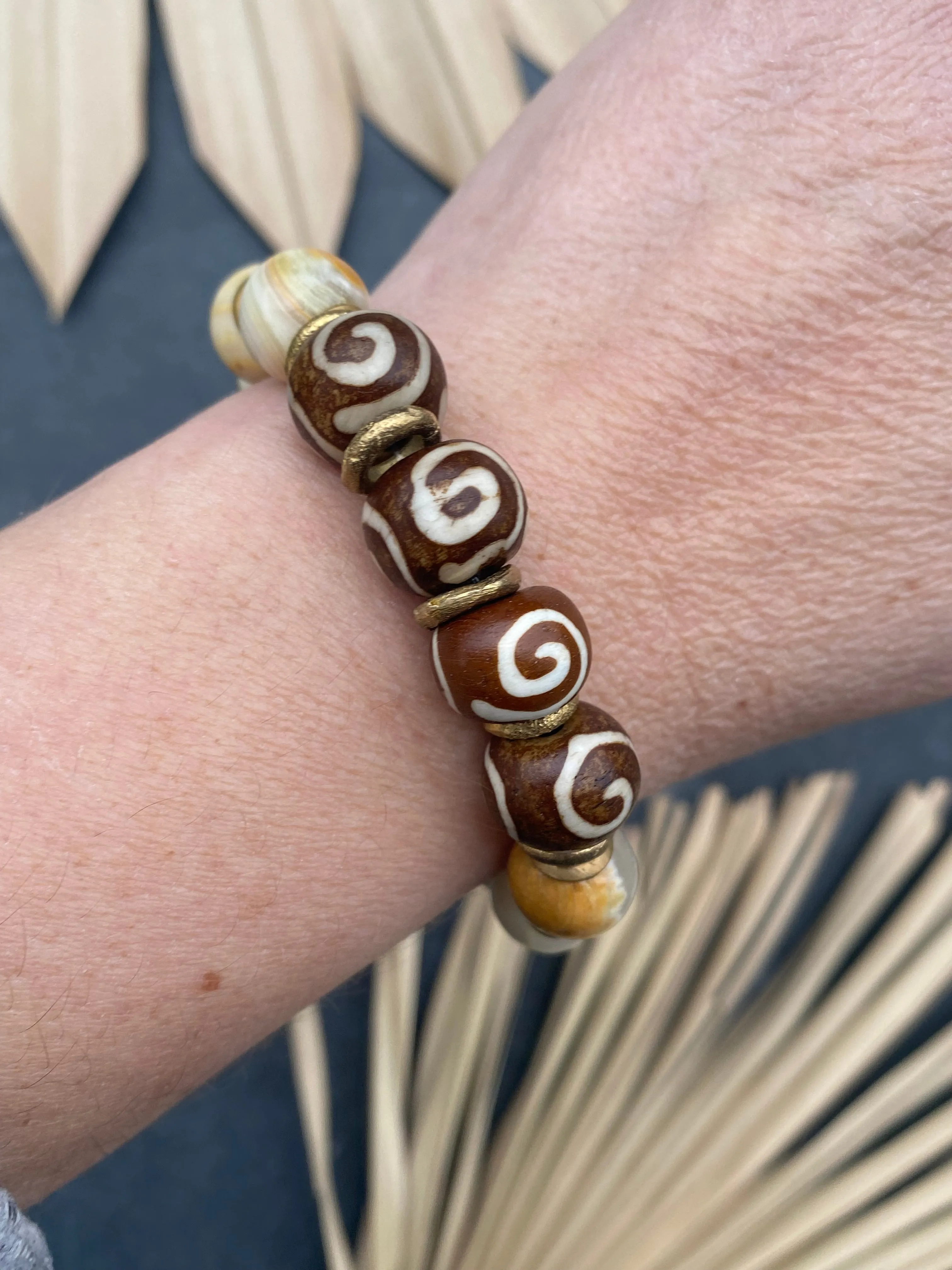 African wood, indoneisan glass, stone, African brass, elastic cording, bracelet, jewelry