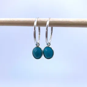 Gemstone earrings with turquoise (blue) oval crystal drops on silver small hoops