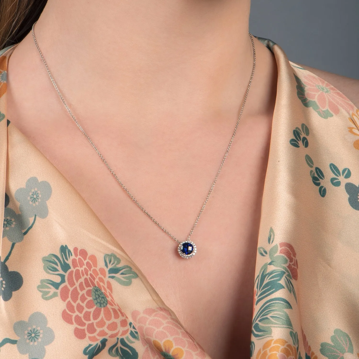 Jewelili Sterling Silver with Round Created Blue and White Sapphire Halo Pendant Necklace